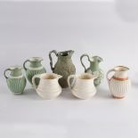 A pair of Minton relief moulded jugs, and five other jugs,