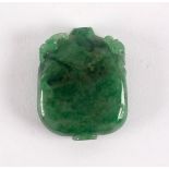 A Chinese jadite snuff bottle of rectangular section carved with Kylin shoulders,