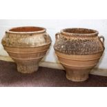A near pair of Spanish terracotta olive jars, of bulbous form with lug handles,