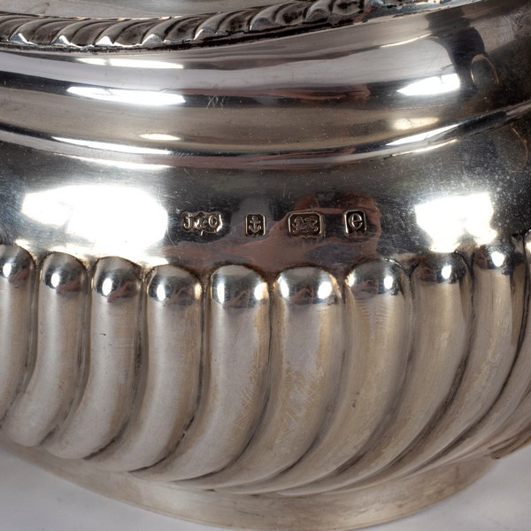 A silver teapot, J & C, Birmingham 1904, of half-ribbed form with ebonised handle and finial, - Image 2 of 2