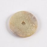 A Chinese white jade bi disc carved with clouds,
