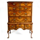 A George I walnut chest fitted two short over three long drawers on a later three drawer stand, 98.