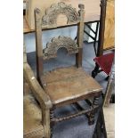 A 17th Century oak single chair with foliate carved arch shaped splats,