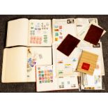 A small collection of stamps albums including an all world accumulation of stamps,