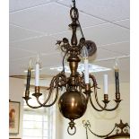 A Flemish brass six-light chandelier with scroll branches,