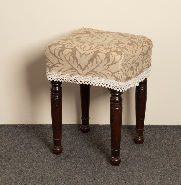 A Victorian upholstered stool on turned legs,