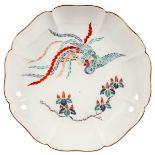 A Japanese Kakiemon plate, probably 18th Century, painted with a phoenix, 19.