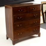 A George III oak and crossbanded chest of two short over three long drawers, on bracket feet, 108.