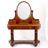 A Victorian mahogany dressing table with oval mirror and platform base,