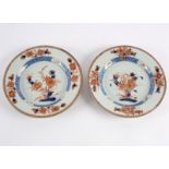 A pair of Imari plates, 18th Century, painted with chrysanthemums and peonies, 22.