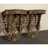 A pair of painted rosewood wall brackets, the bowfront platform on stylised dragon supports, 28.