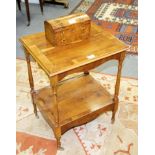 A yew wood two-tier table and a tea caddy