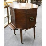 A George III mahogany wine cooler of octagonal shape, on square tapering legs with castors,