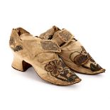 A pair of 17th Century silk court shoes with leather soles,