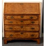 An 18th Century burr walnut and herringbone banded bureau,