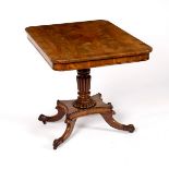 A Regency rosewood table with plain frieze on reeded taper column and four splay feet,