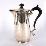 A silver hot water jug, Sheffield 1918, initialled H, with ebonised finial and handle,
