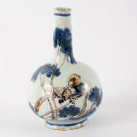 A Delft polychrome vase with tapered slender neck, painted birds in shrubs,