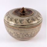 A Persian pottery bowl and cover with foliate and stylised decoration,