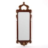 A mahogany wall mirror of 18th Century design,