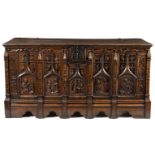 A 16th Century North German oak coffer (restorations) the rectangular plank top above five gothic