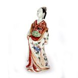 A Japanese Arita figure of a Bijin, circa 1700,