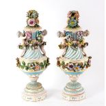 A pair of late 19th Century Continental vases and covers,