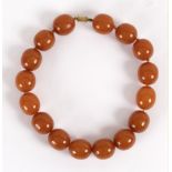 An amber necklace of large slightly oval beads,