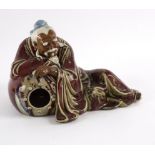 A Chinese pottery figure by Liu Zemian of Liu Ling, drunk,