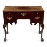 A George II walnut lowboy fitted five drawers, on carved cabriole legs with ball and claw feet,