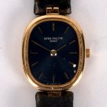 A lady's Patek Philippe watch, the blue oblong dial with gilt baton markers and hands,