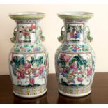 A pair of 19th Century Canton famille rose vases painted panels of warriors on horseback,