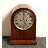 An arch-top mantel clock, the silvered dial signed Mappin & Webb, London and with Roman numerals,