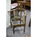 An 18th Century oak corner chair with later splat back head rest,