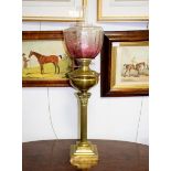A Victorian oil lamp with brass column and glass shade CONDITION REPORT: Well and