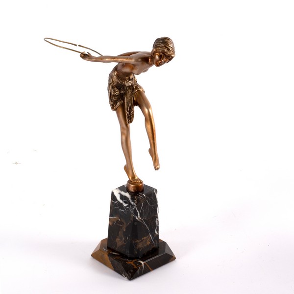 After Demetre Chiparus/Young Girl with Hoop/an Art Deco style figure with bronze colour finish on a