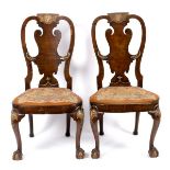A pair of 18th Century walnut splat back chairs in the manner of Giles Grendey,