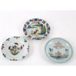 Three English Delft plates, first half of the 18th Century,