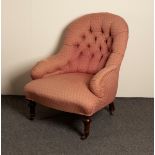 A Victorian button back chair on turned legs