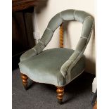 A Victorian tub chair with barley twist supports and legs,