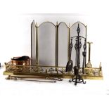 A pierced brass fire curb, a brass and wire mesh fire screen, various fire irons etc.