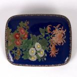 A Japanese cloisonné brooch of oblong form, decorated flowers to a blue ground, 7cm x 5.