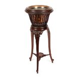 An Edwardian mahogany slatted jardinière stand on three cabriole legs,