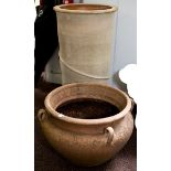 A large tapering cylindrical terracotta flower urn,