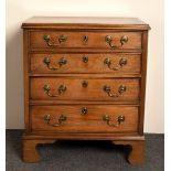 A narrow mahogany chest of four drawers on bracket feet,