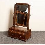An 18th Century walnut swing frame mirror, the base fitted two short over one long drawer,