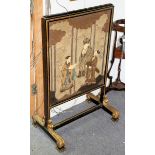 A Regency parcel gilt screen with needlework panel depicting three sages, on carved supports,