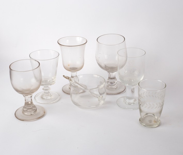 An 18th Century wine glass with knopped stem on a circular base, 14cm high, various other glasses,