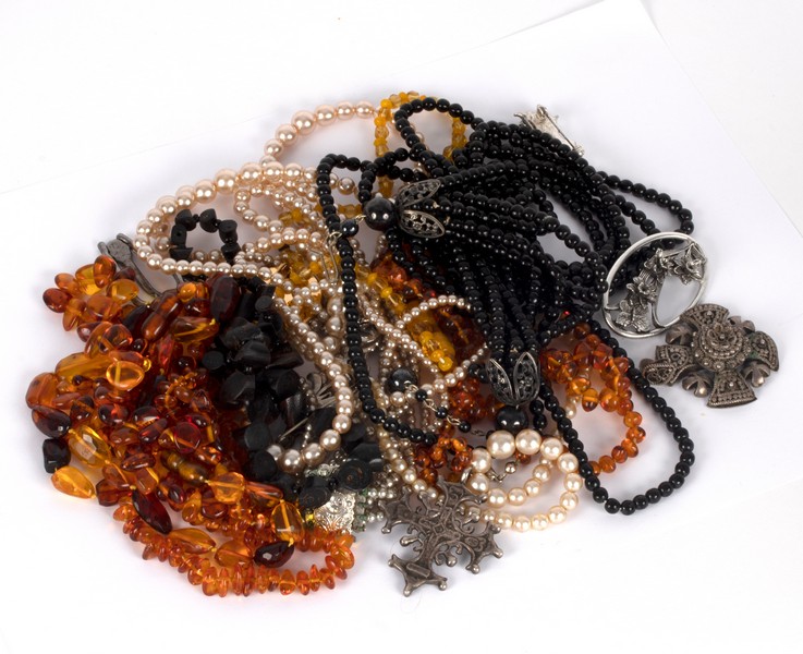 A quantity of costume jewellery including amber bead necklaces, faux pearls, marcasite etc. - Image 2 of 2