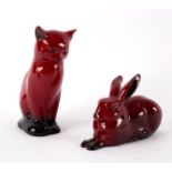 A Royal Doulton flambé figure of a hare, 11cm long and a cat, 12.